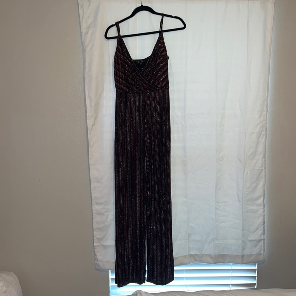 sparkly jumpsuit .